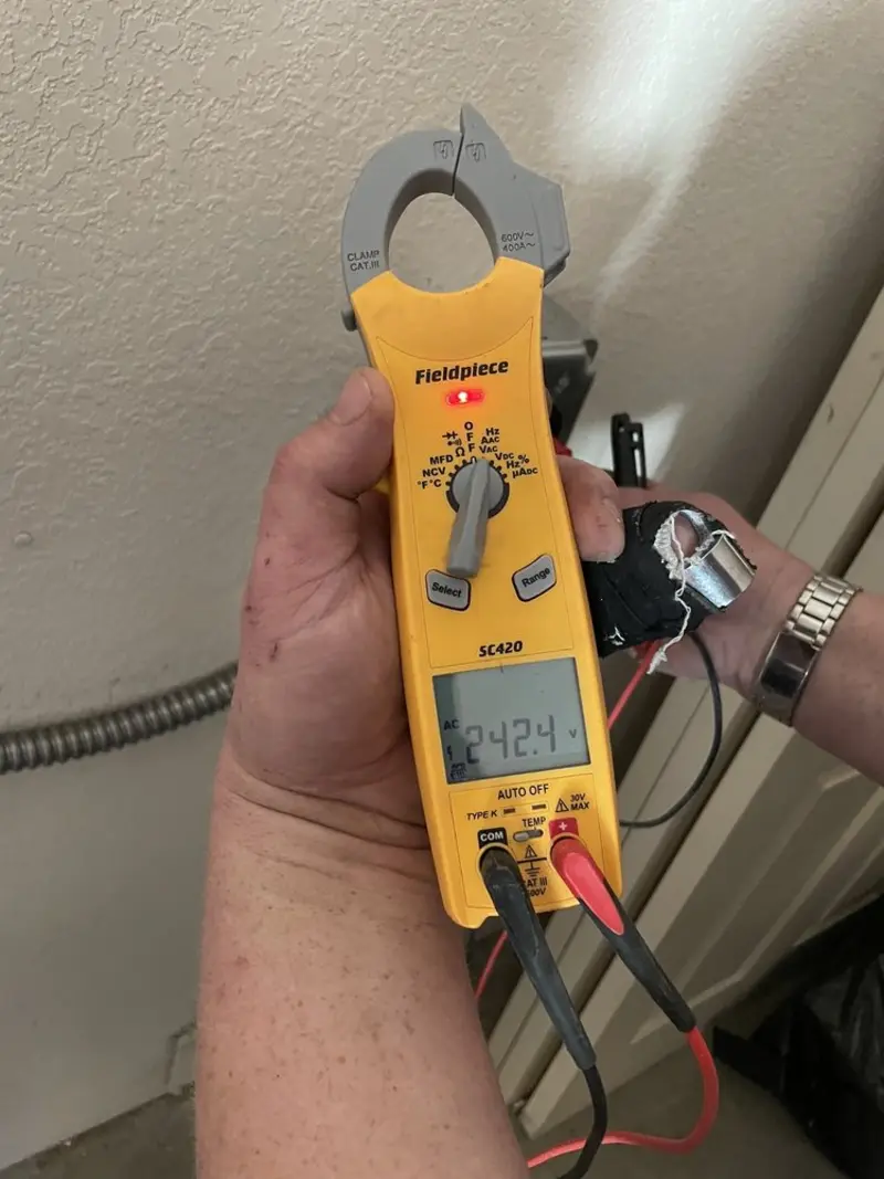 Voltage testing with clamp meter during Electrical Installation Services in Eden